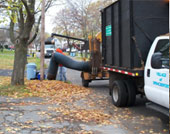 Image of Public Works truck at a task in the Village